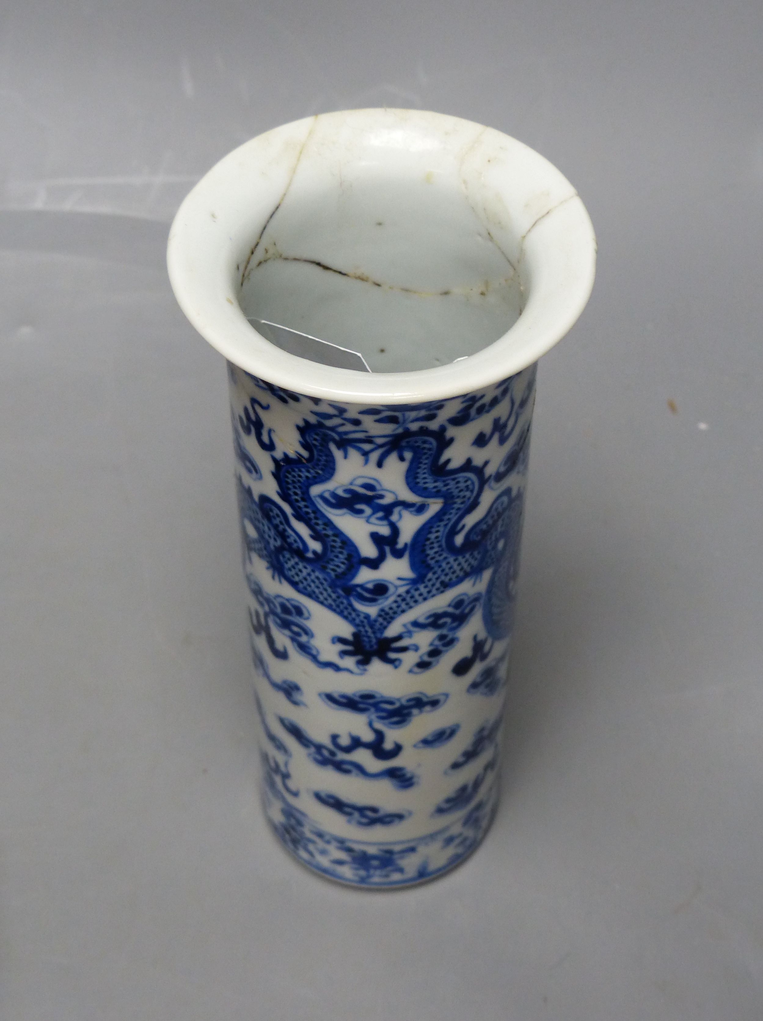 A large Japanese Imari bowl, Meiji period, diameter 31cm, and a Chinese blue and white sleeve vase